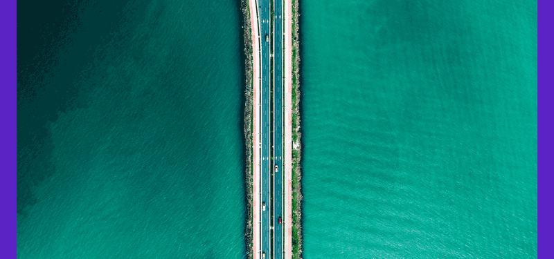 highway surrounded by blue waters